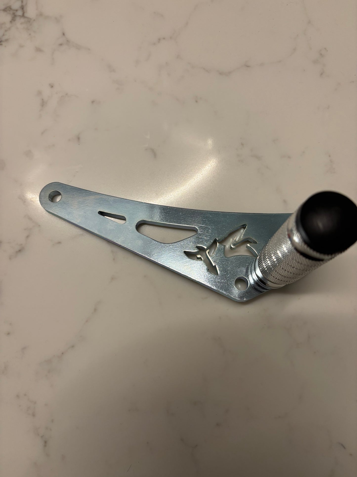 Chrome shift lock bracket